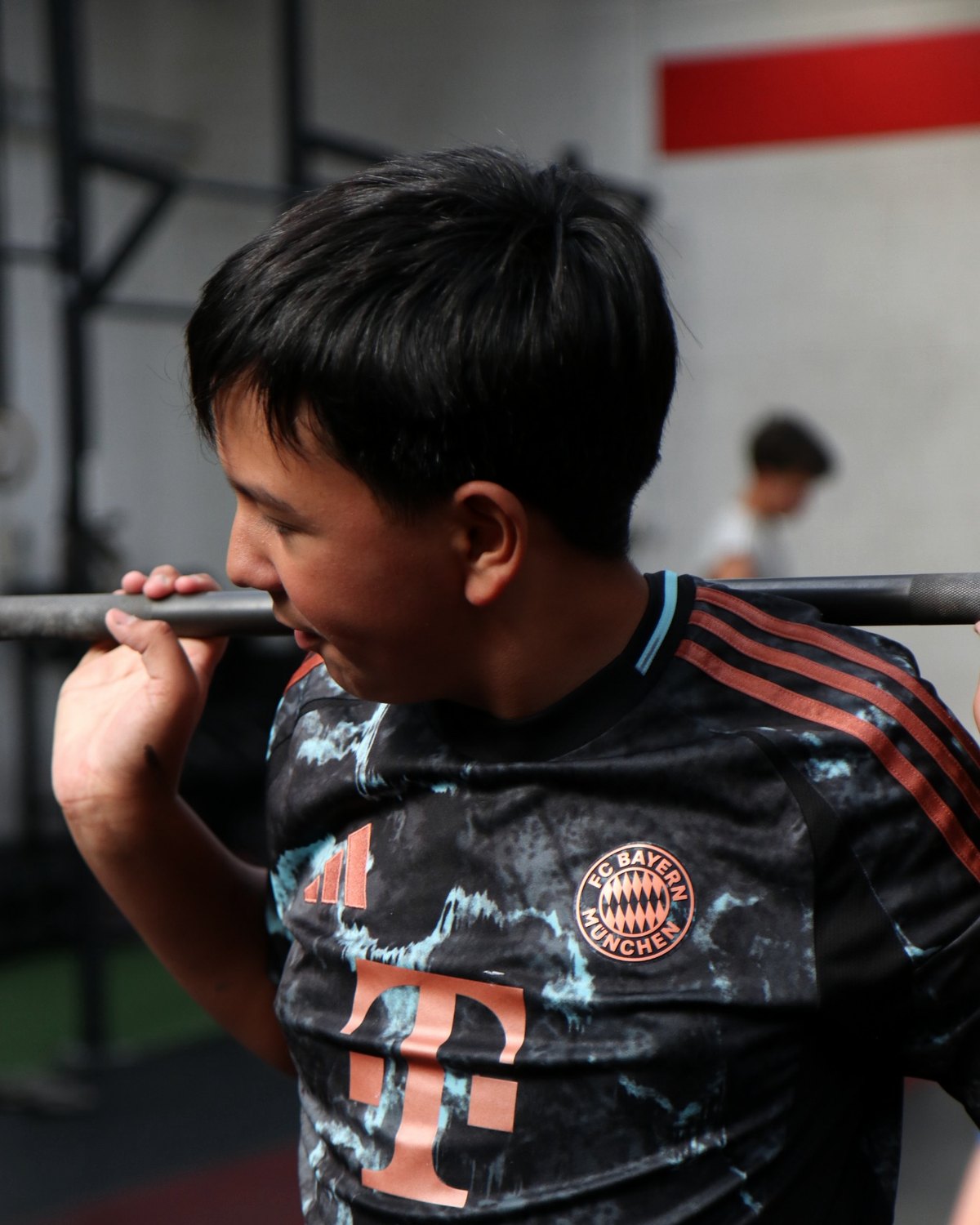 Jr.EP athlete learning barbell positioning